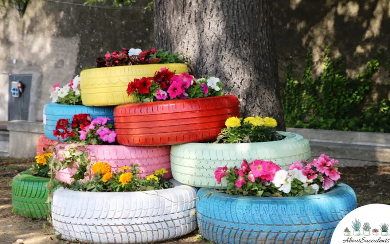 paysage de jardin de fleurs avec des pneus